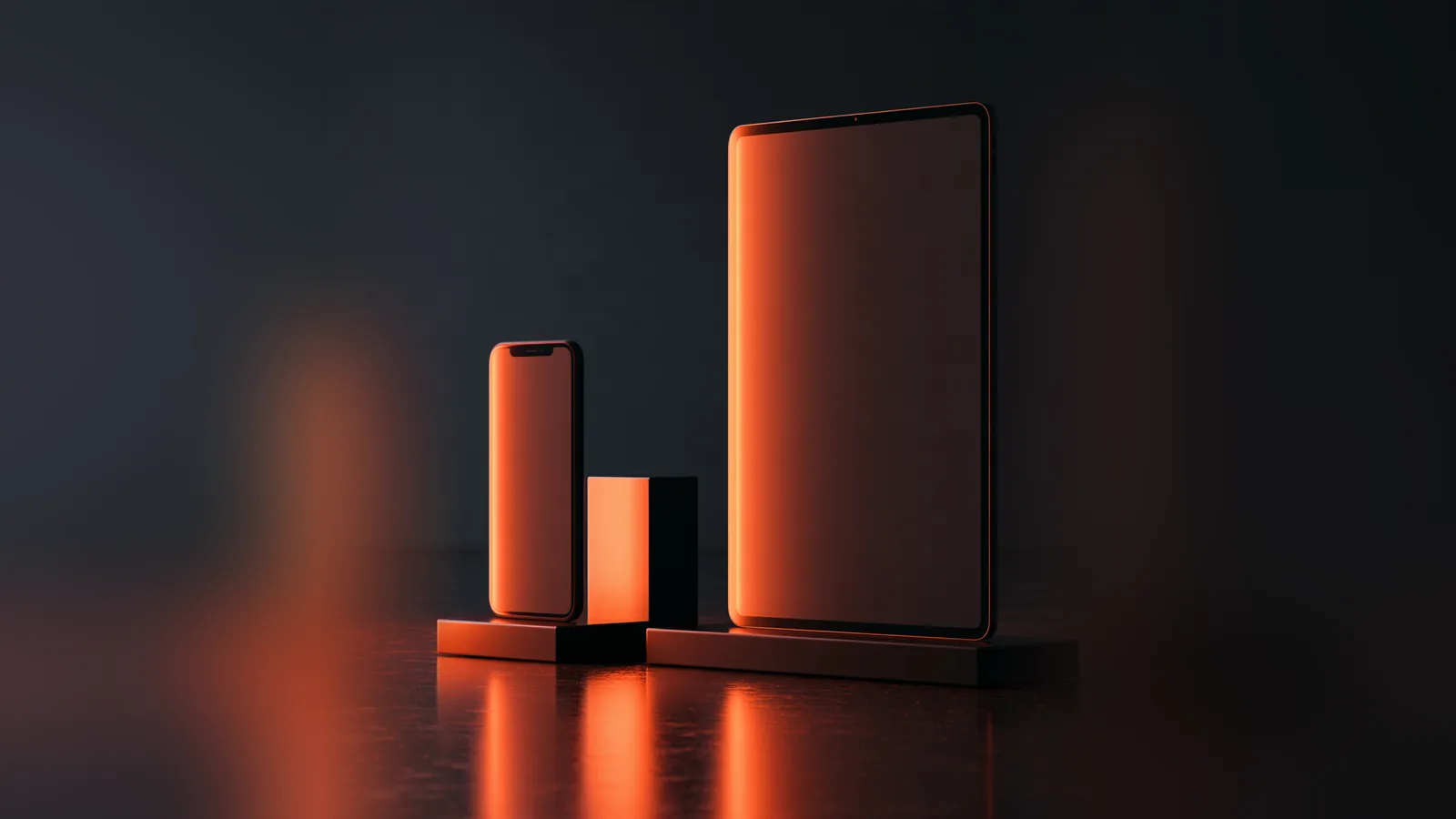 Smartphone et tablette sur fond sombre, symbole du design responsive